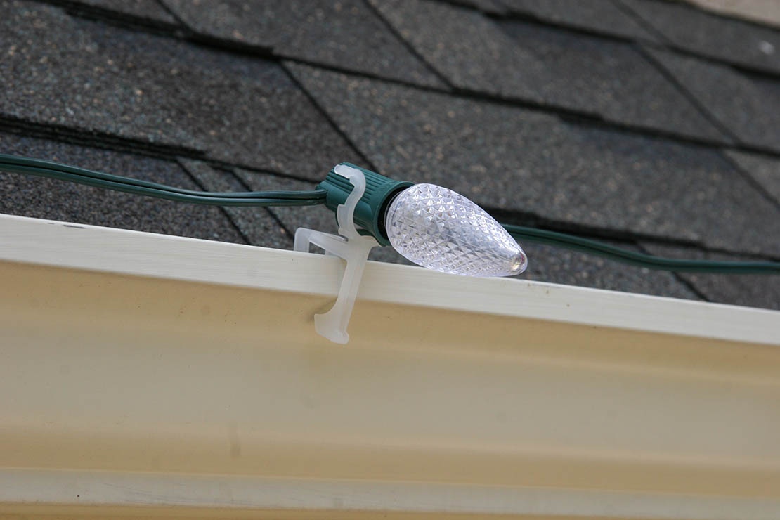 c9 Christmas lights held securely on gutters with the all in one light clip