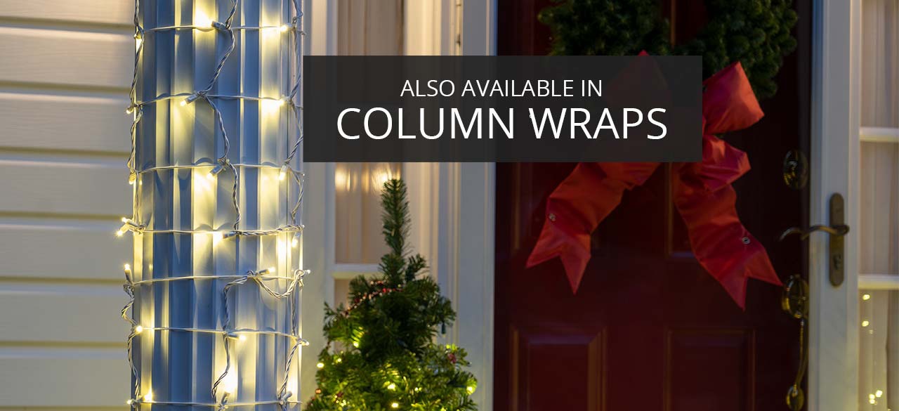 StretchNet Pro warm white Christmas column wrap lights on a white porch column beside a front door with decorative wreath and red bow